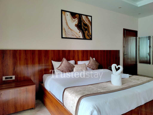 Bedroom one of S-24/2 TrustedStay Service Apartment in Gurgaon, Delhi NCR